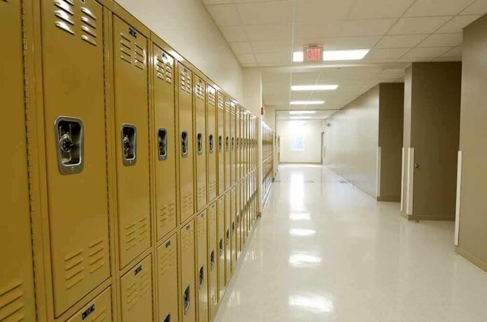 shutterstock_84230776 Row of yellow school lockers in an empty hallway