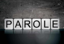 Mason Killer Granted PAROLE After 60 Years! Blocks spelling PAROLE on grungy background.
