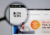Magnifying glass focusing on CBS News website logo