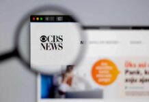 Magnifying glass focusing on CBS News website logo