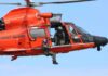 Rescue helicopter with crew performing hoist operation