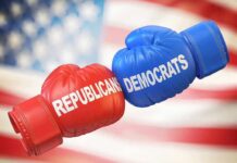 Boxing gloves labeled Republicans and Democrats bump together
