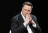 GOP Rep Calls For Musk Investigation Despite Using His Money For Ads Elon Musk seated in a dark setting with hands steepled near his face