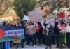 B. J. Daniels and Eugene Sims among protesters holding signs at a pro-Palestine rally