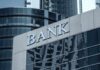 Bank building facade with large sign and glass windows