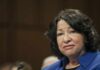Rival SCOTUS Justices United In Shock Civil Liberties Case woman speaking at a hearing with a microphone visible