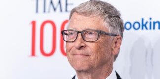 Man in suit and bow tie at Time 100 event.