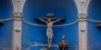 Crucifixion scene with Jesus, Mary, and another figure.