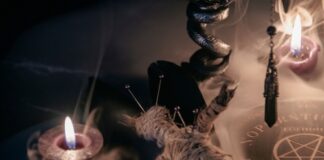 A dark, mystical scene featuring candles, a voodoo doll, and occult symbols