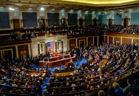 Congressional meeting in session with members seated in chambers.