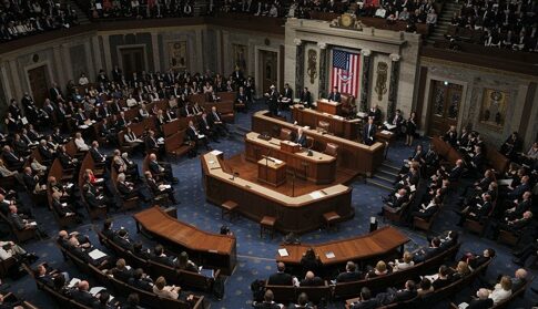 A large assembly of politicians in a legislative chamber