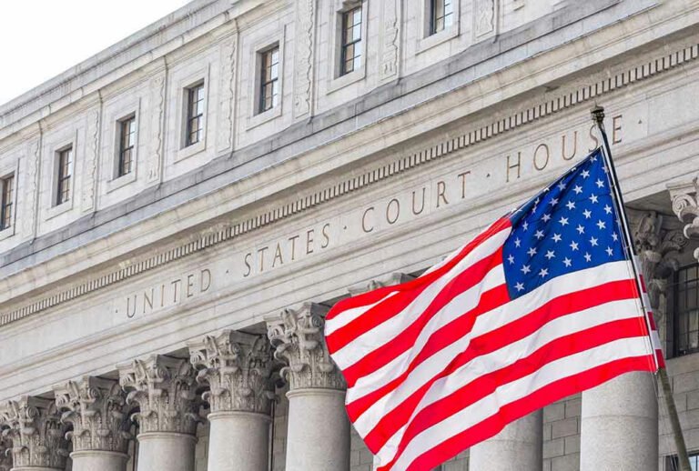United States courthouse with American flag waving.