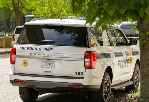 FBI police vehicle parked on a city street
