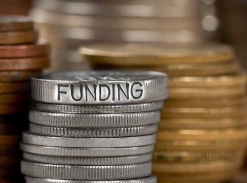 Stack of coins with the word funding engraved